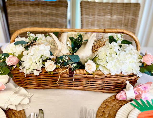 Wicker basket with flowers and bunnies