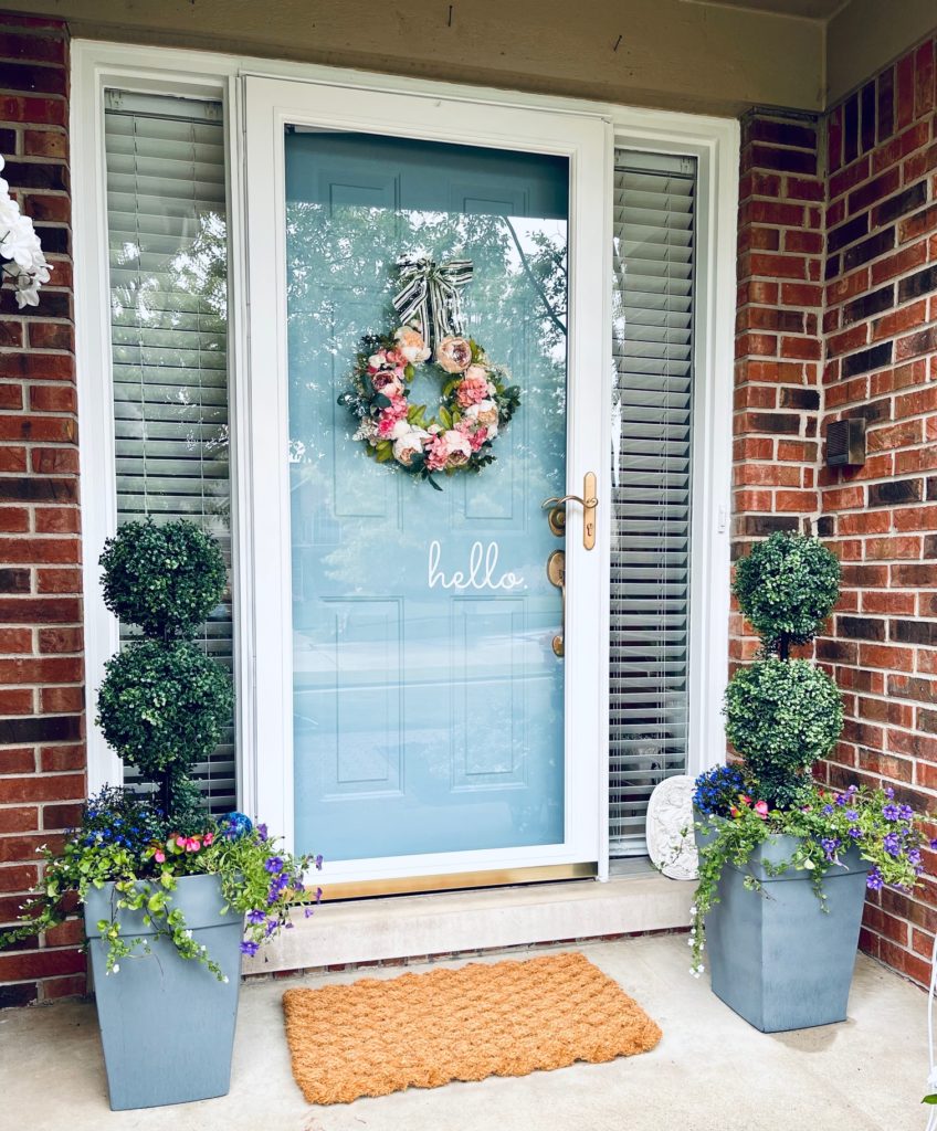 How To Do A Quick Front Porch Makeover adding planters to the porch