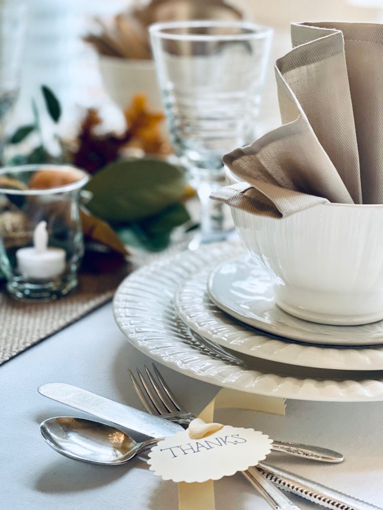 A beige napkin folded in a bowl