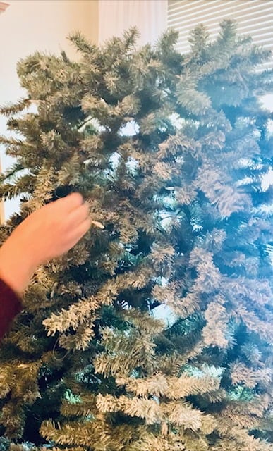 What Is The Best Way To Decorate A Christmas Tree Fluffing the branches and spray snow