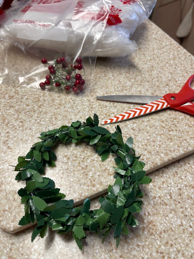 Showing the red berries removed from the wreath