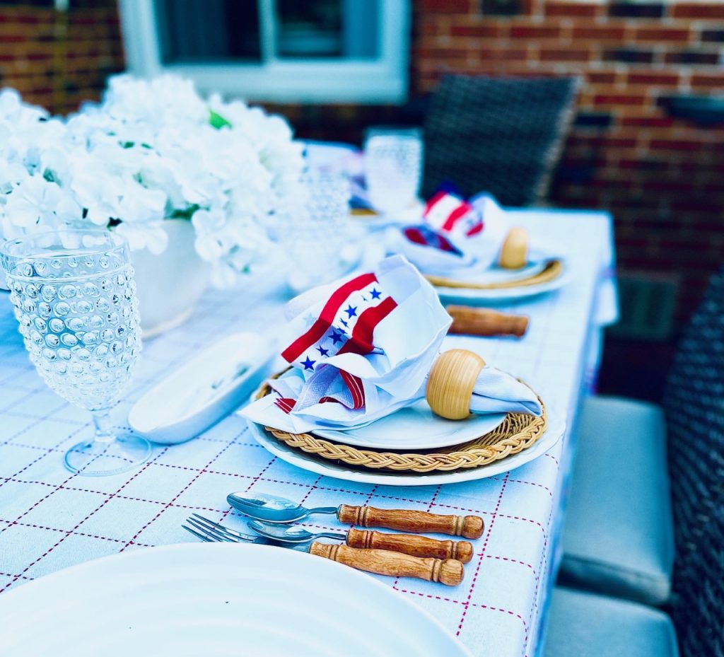 Simple table setting with bamboo silverware, wicker plates