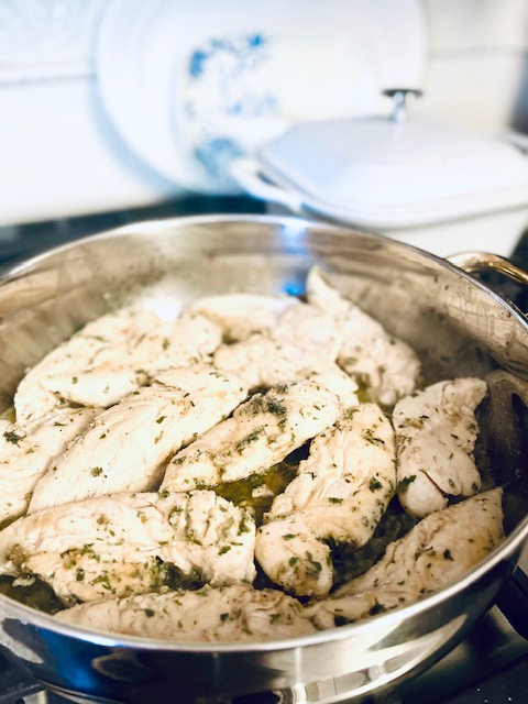 Seasoned chicken cooking in the pan