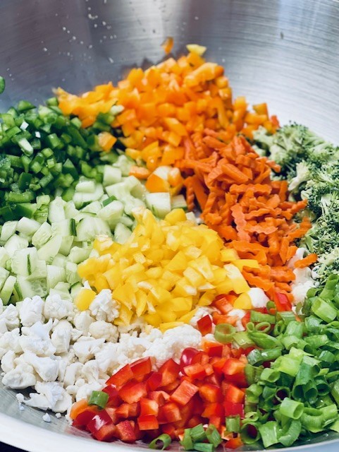 Cut up vegetables for a pasta salad