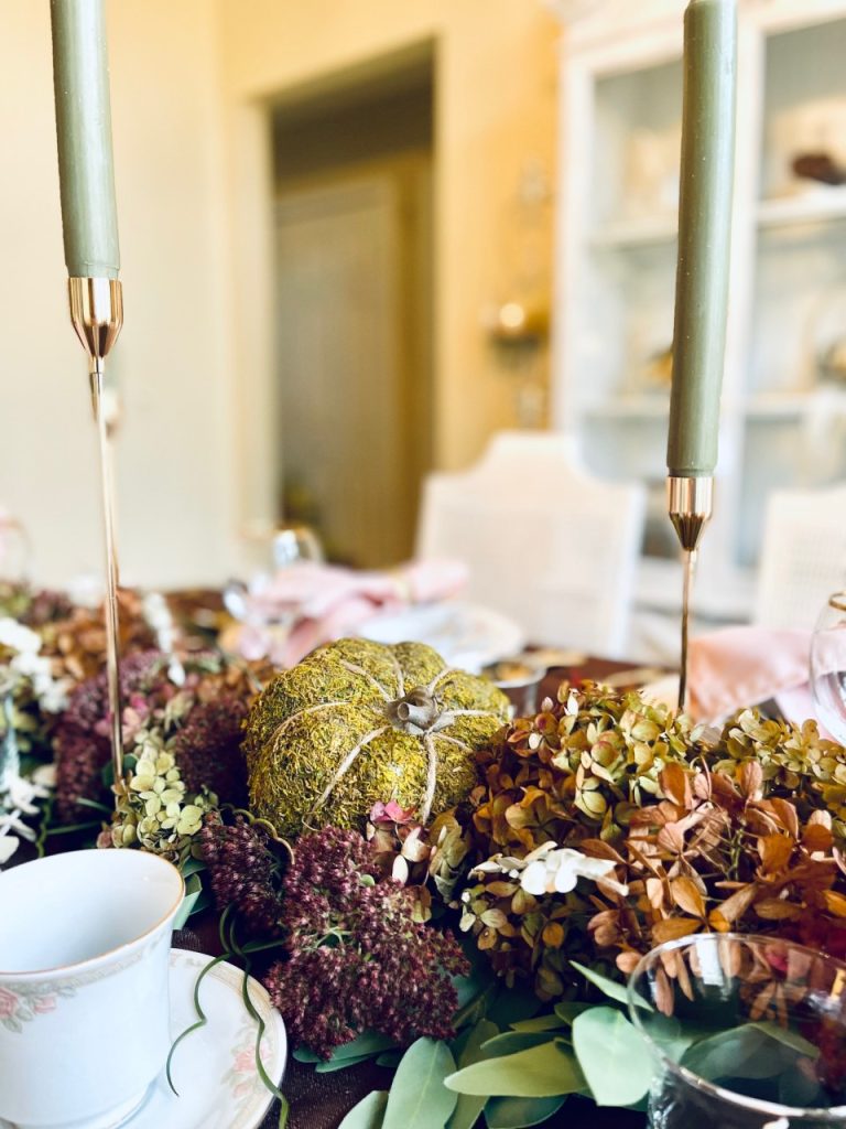 Showing a moss pumpkin on the fall table scape
