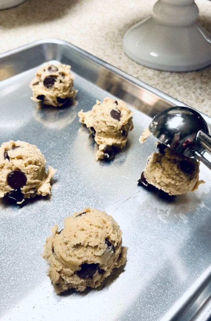 Scooping the cookies onto a cookie sheet