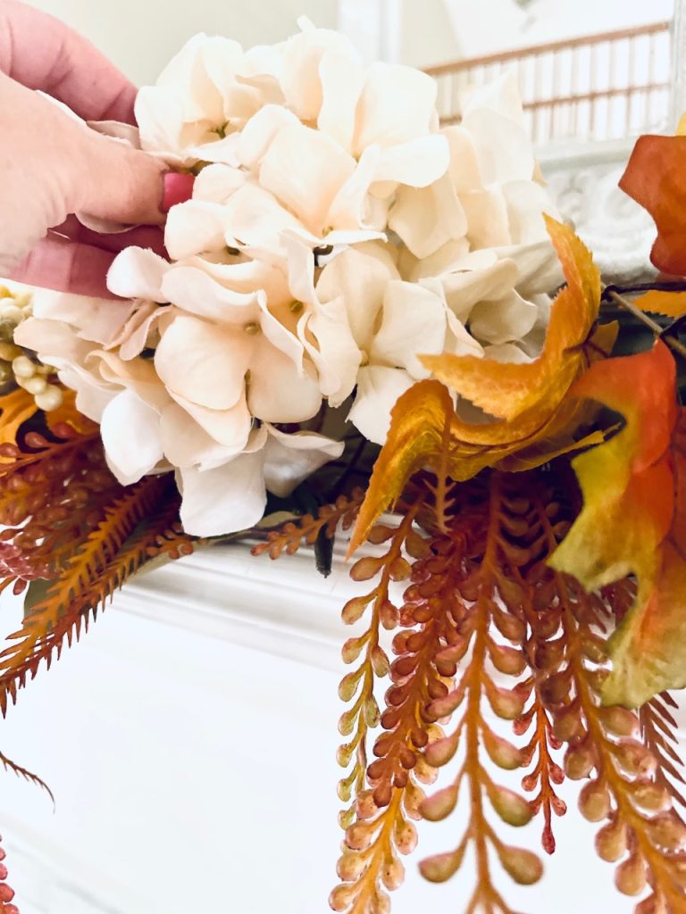 Placing a flower on the fireplace mantel