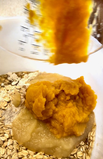 Pumpkin being mix into the flour