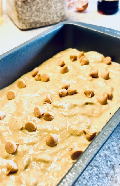 Pouring the pumpkin batter in the loaf pan