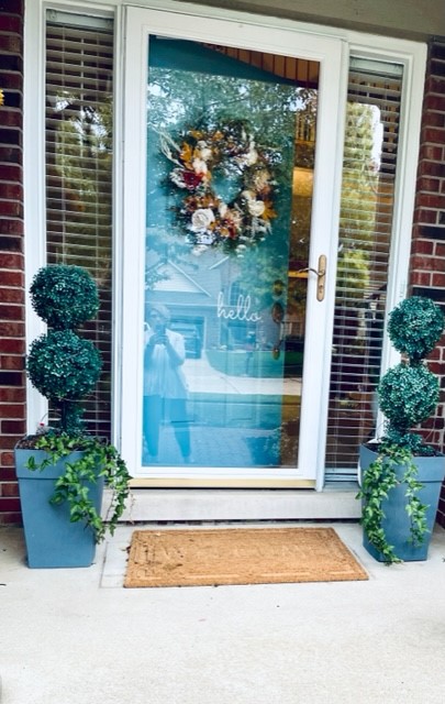 My before picture of the small porch I am decorating for fall