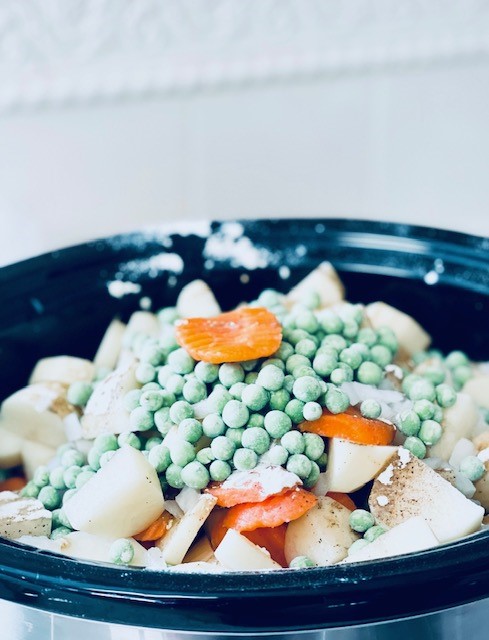 Potatoes, carrots, and peas in the crock pot