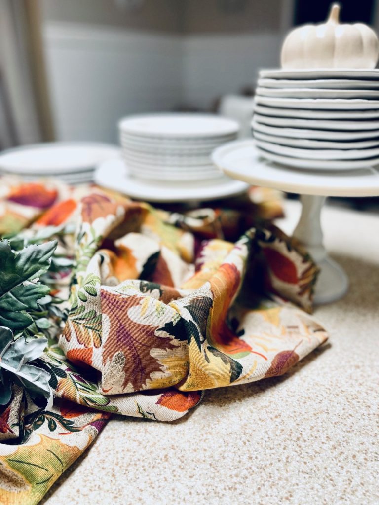 A fall  harvest table cloth to use for the centerpiece for the buffet