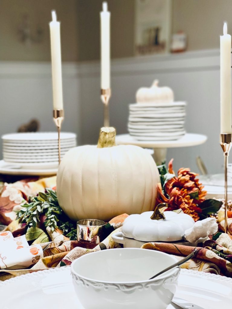Picture of the buffet with candles, pumpkin and fall decor