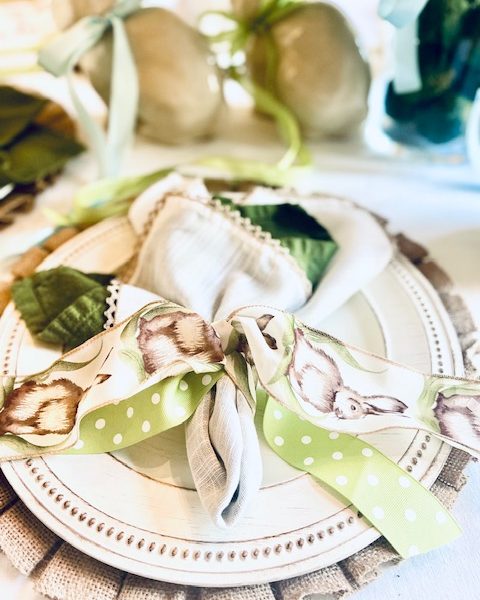 ribbon tied around napkins to create an Easter table scape