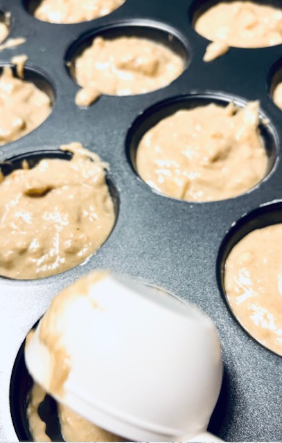 Easy Salted Caramel Apple Muffins Made Gluten Free filling the baking cups