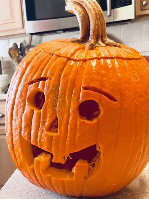 How To Have The Most Fun Carving Pumpkins cutting  a traditional pumpkin